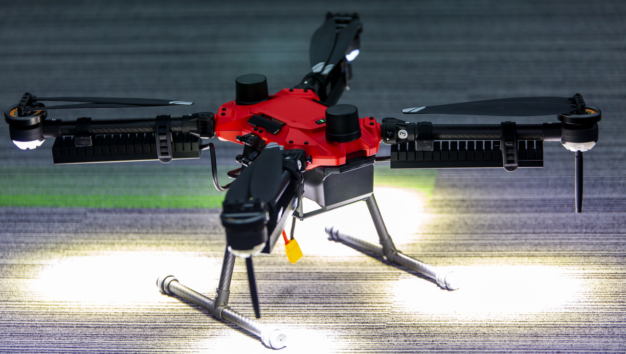 Tethered drone operating at night under floodlights