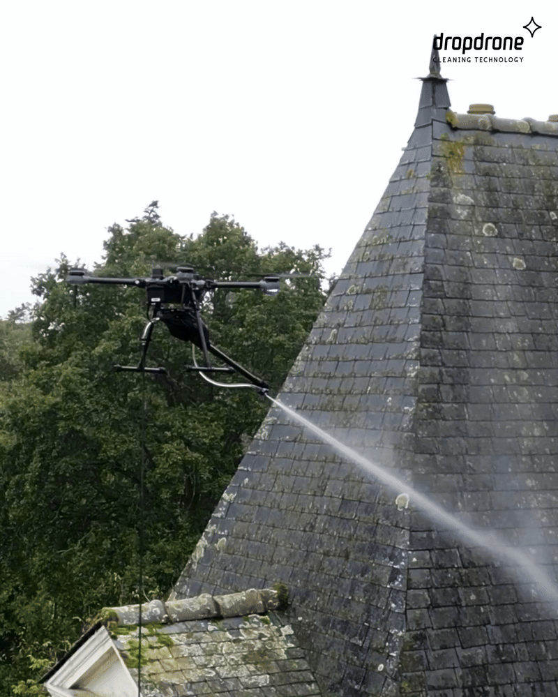 Drone cleaning a rooftop at height